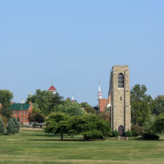 The Joseph Dill Baker Memorial Carillon in Baker Park with Frederick, Maryland Skyline in background.